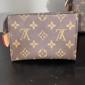 LOUIS VUITTON MONOGRAM TOILETRY
POUCH SMALLER ONE